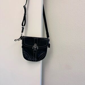 Coach crossbody bag black leather with canvas strap.